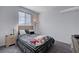 Cozy bedroom with neutral tones, a comfortable bed, and natural light at 1135 Tektite Ave, Henderson, NV 89011