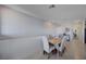 Bright dining area featuring a modern table with six upholstered chairs and tile flooring at 1135 Tektite Ave, Henderson, NV 89011