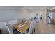 Elegant dining area with seating, a decorative table runner, and access to other areas at 1135 Tektite Ave, Henderson, NV 89011