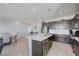 Well-equipped kitchen with an island, stainless steel appliances and ample cabinet space at 1135 Tektite Ave, Henderson, NV 89011