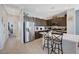 Modern kitchen with a large island, stainless steel refrigerator, and stylish bar stools at 1135 Tektite Ave, Henderson, NV 89011