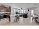 Spacious open-concept living area with tile floors, kitchen island, and contemporary decor at 1135 Tektite Ave, Henderson, NV 89011