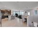 Bright open-concept living space featuring tile flooring, modern lighting, and comfortable furniture at 1135 Tektite Ave, Henderson, NV 89011