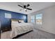 Cozy main bedroom with a queen-sized bed, ceiling fan, and window views at 1135 Tektite Ave, Henderson, NV 89011