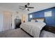 Comfortable main bedroom with a queen-sized bed, ceiling fan, and ample storage at 1135 Tektite Ave, Henderson, NV 89011