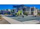 Community playground with modern play equipment and shade structures for outdoor Gathering fun at 1135 Tektite Ave, Henderson, NV 89011