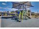A vibrant community playground with modern equipment nestled among stylish townhomes, perfect for Gathering enjoyment at 1135 Tektite Ave, Henderson, NV 89011