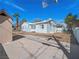 Wide backyard showing the home's exterior, yard, and potential for outdoor recreation and customization at 1139 5Th Pl, Las Vegas, NV 89104