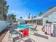 Outdoor living with seating area, pool, palm trees in an open patio at 1139 5Th Pl, Las Vegas, NV 89104