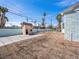 Expansive backyard with a unique playhouse, offering great potential for outdoor activities and customization at 1139 5Th Pl, Las Vegas, NV 89104