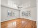 Bright bedroom featuring hardwood floors, large windows with shutters, and classic ceiling fan at 1139 5Th Pl, Las Vegas, NV 89104
