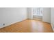 Bright bedroom with hardwood floors, built-in shelves, and a large window at 1139 5Th Pl, Las Vegas, NV 89104