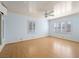 Large bedroom featuring hardwood floors, multiple windows, and a ceiling fan at 1139 5Th Pl, Las Vegas, NV 89104