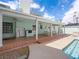 Spacious covered patio with an outdoor kitchen, dining area, and access to the pool at 1139 5Th Pl, Las Vegas, NV 89104