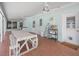 Spacious covered patio with brick flooring, ceiling fans, and a dining area, great for outdoor living at 1139 5Th Pl, Las Vegas, NV 89104