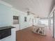 Charming covered patio featuring an outdoor dining area, ceiling fans, and brick flooring at 1139 5Th Pl, Las Vegas, NV 89104