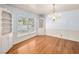 Dining room features hardwood floors, a chandelier, and built-in shelving at 1139 5Th Pl, Las Vegas, NV 89104