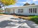 Charming single-story home with a well-maintained yard, brick accents, and a concrete driveway at 1139 5Th Pl, Las Vegas, NV 89104