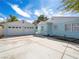 View of the detached garage and a section of the house, accented by a wide driveway at 1139 5Th Pl, Las Vegas, NV 89104