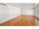 Spacious living room featuring hardwood floors and plantation shutters at 1139 5Th Pl, Las Vegas, NV 89104