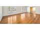 Spacious living room featuring hardwood floors, plantation shutters, and bright lighting at 1139 5Th Pl, Las Vegas, NV 89104