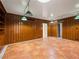 Living room with custom wood paneling, recessed lighting, and tiled floors at 1139 5Th Pl, Las Vegas, NV 89104