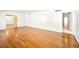 Spacious living room with hardwood flooring and bright, neutral paint, offering a versatile living space at 1139 5Th Pl, Las Vegas, NV 89104