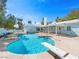 Inviting backyard pool featuring diving board, lounge chair, and ample space for entertaining, perfect for relaxation at 1139 5Th Pl, Las Vegas, NV 89104