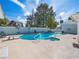 Beautiful backyard with a large pool, diving board, lounge area, and lush landscaping at 1139 5Th Pl, Las Vegas, NV 89104