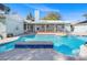 Inviting pool with a blue tile spa and a lush backyard, perfect for outdoor relaxation and entertainment at 1139 5Th Pl, Las Vegas, NV 89104