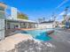Beautiful backyard oasis featuring a sparkling pool, lush landscaping, and ample seating areas at 1139 5Th Pl, Las Vegas, NV 89104