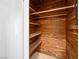 Unique storage closet featuring warm cedar wood shelves and ample vertical space for storage at 1139 5Th Pl, Las Vegas, NV 89104