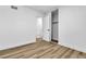 Bedroom with a closet, doorway, white walls and trim, and wood-look floors at 1940 Walker St, Las Vegas, NV 89106