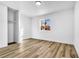 Bedroom with a window, white walls and trim, wood-look floors, and a closet at 1940 Walker St, Las Vegas, NV 89106