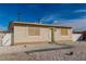 Charming single-story home exterior with a well-maintained front yard and neutral stucco facade at 1940 Walker St, Las Vegas, NV 89106