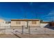 A single-story home with a well-maintained exterior, gravel landscaping, and a fenced yard at 1940 Walker St, Las Vegas, NV 89106