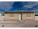 A charming single-story home featuring a simple design, fresh gravel landscaping, and a fenced yard at 1940 Walker St, Las Vegas, NV 89106