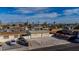 View of the property highlighting its gravel front yard and proximity to neighborhood amenities at 1940 Walker St, Las Vegas, NV 89106