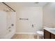 Bathroom featuring bathtub and shower with white tiling and modern fixtures at 2100 Quarry Ridge St # 106, Las Vegas, NV 89117