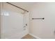Bathroom featuring bathtub and shower with white tiling and modern fixtures at 2100 Quarry Ridge St # 106, Las Vegas, NV 89117