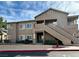 Beautiful tan building with a welcoming entrance and stairs leading to upper units at 2100 Quarry Ridge St # 106, Las Vegas, NV 89117