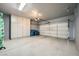 Spacious garage features a speckled floor, ample storage cabinets and an automatic door at 2100 Quarry Ridge St # 106, Las Vegas, NV 89117