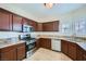 Charming kitchen features stainless steel appliances, granite counters, and natural light at 2100 Quarry Ridge St # 106, Las Vegas, NV 89117