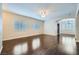 Bright living room boasts hardwood floors, natural light from windows, and a ceiling fan at 2100 Quarry Ridge St # 106, Las Vegas, NV 89117