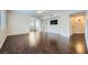 Spacious living room features hardwood floors, neutral paint, and modern ceiling fan at 2100 Quarry Ridge St # 106, Las Vegas, NV 89117