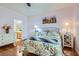 Comfortable bedroom featuring hardwood floors and floral bedding, offering a bright and inviting space at 2152 Mountain City St, Henderson, NV 89052