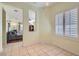 Bright dining room with tile flooring and shuttered windows, seamlessly connected to the living area at 2152 Mountain City St, Henderson, NV 89052