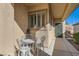 Inviting front porch with decorative metal chairs and table, creating a welcoming entrance to the home at 2152 Mountain City St, Henderson, NV 89052