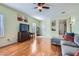 Spacious living area featuring a ceiling fan, wood floors, neutral walls, and ample natural light at 2152 Mountain City St, Henderson, NV 89052