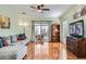 Inviting living room featuring hardwood floors, comfortable seating, and access to the backyard at 2152 Mountain City St, Henderson, NV 89052